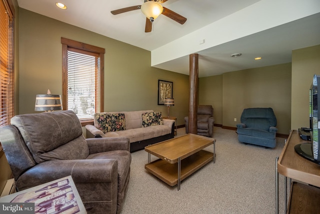 carpeted living room featuring ceiling fan