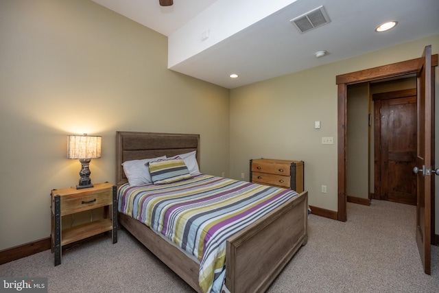 bedroom featuring ceiling fan and light carpet