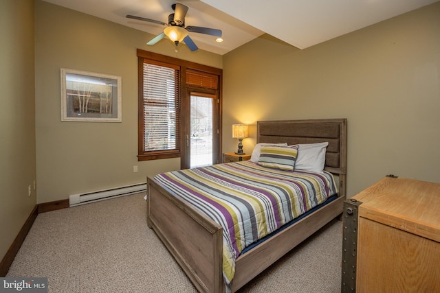 bedroom with baseboard heating, ceiling fan, and light colored carpet