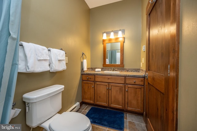 bathroom with vanity, a baseboard radiator, and toilet