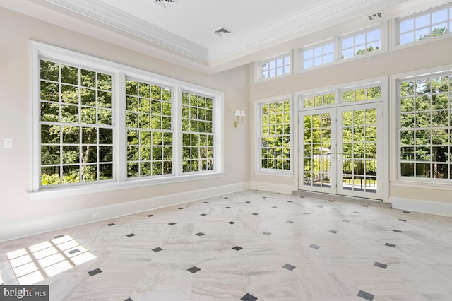 unfurnished sunroom with french doors