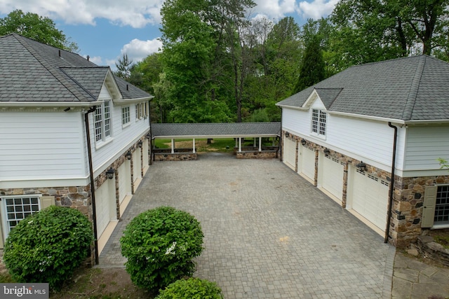 view of patio / terrace featuring a carport and a garage