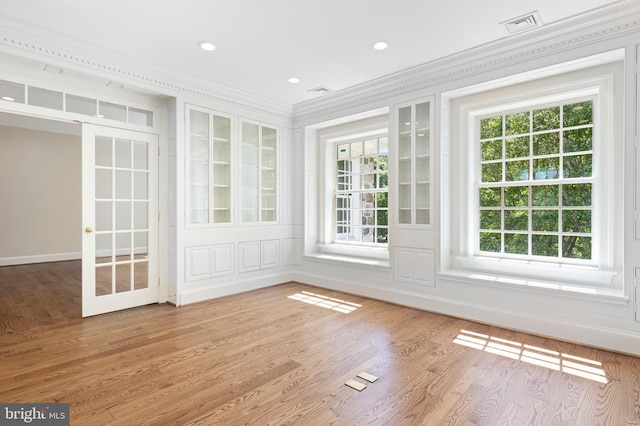 unfurnished sunroom featuring plenty of natural light and french doors