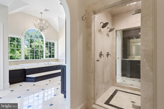 bathroom with a chandelier, shower with separate bathtub, and vaulted ceiling