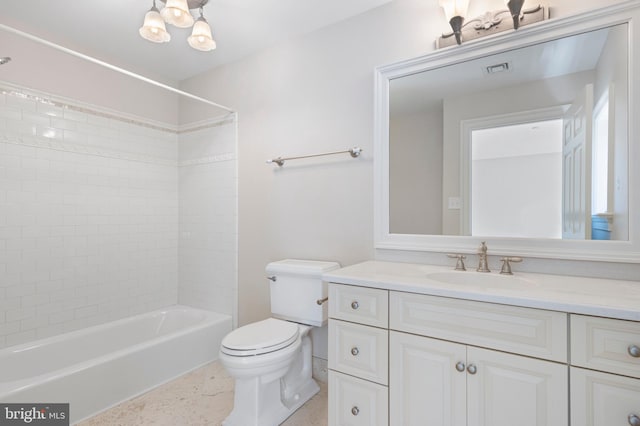 full bathroom featuring vanity, toilet, and tiled shower / bath