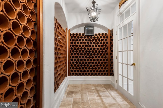 wine cellar featuring an inviting chandelier