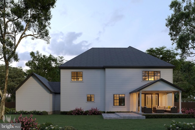 rear view of property with an outdoor living space, a patio area, and a lawn