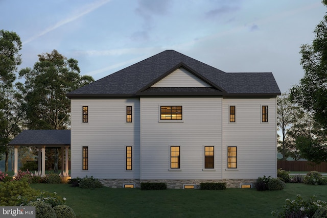 view of home's exterior with a lawn