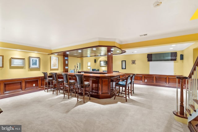 bar featuring a wall mounted air conditioner, ornamental molding, and light carpet