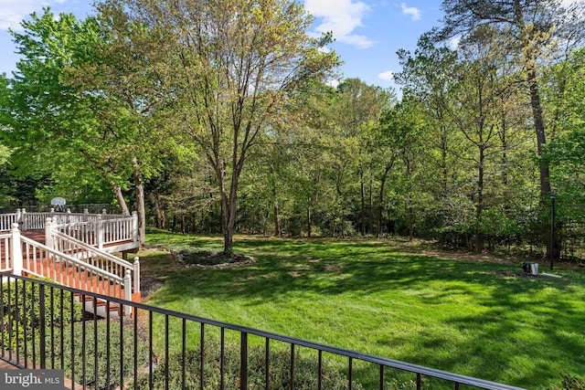 view of yard with a wooden deck