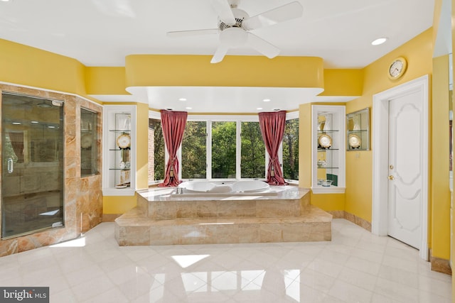 bathroom featuring ceiling fan and shower with separate bathtub