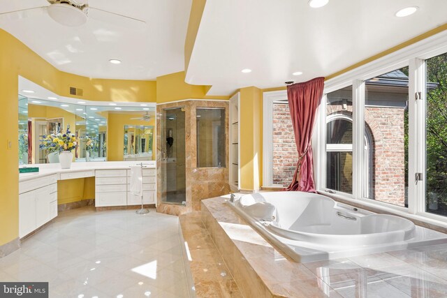 bathroom featuring separate shower and tub and vanity