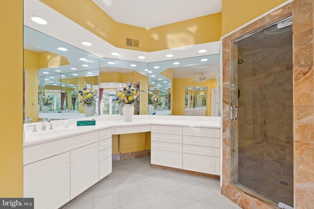 bathroom featuring vanity and a shower with shower door