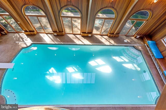 view of swimming pool with a jacuzzi