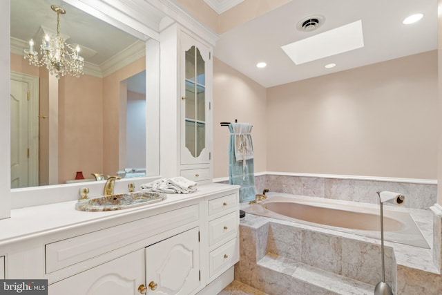 bathroom featuring a skylight, a relaxing tiled tub, a notable chandelier, vanity, and ornamental molding