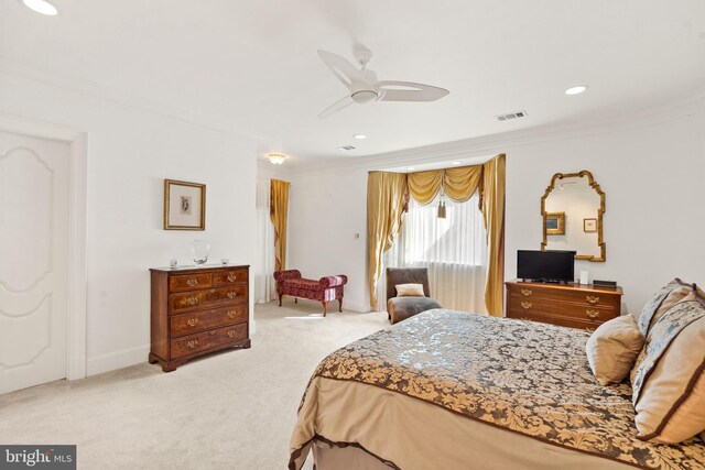 bedroom featuring ceiling fan, crown molding, and light carpet