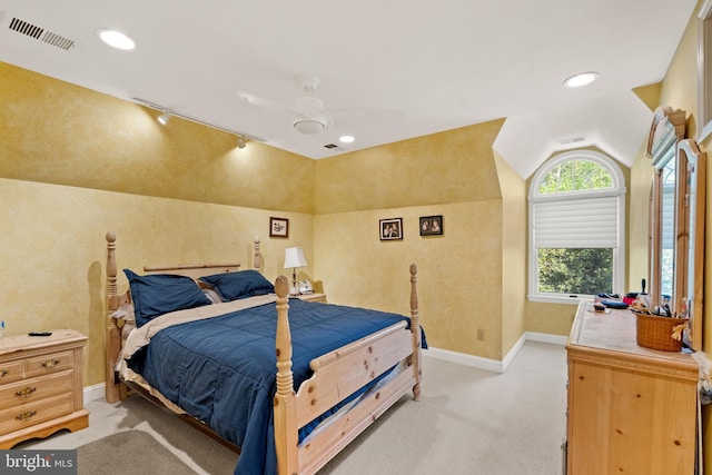 bedroom featuring ceiling fan, light colored carpet, and lofted ceiling