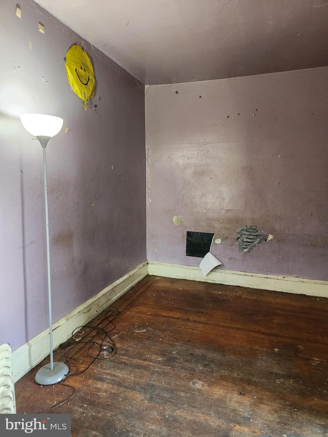 empty room featuring wood-type flooring