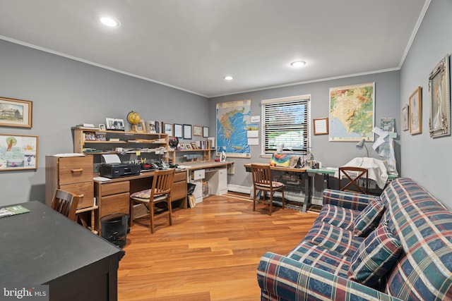 office space featuring ornamental molding and light hardwood / wood-style flooring