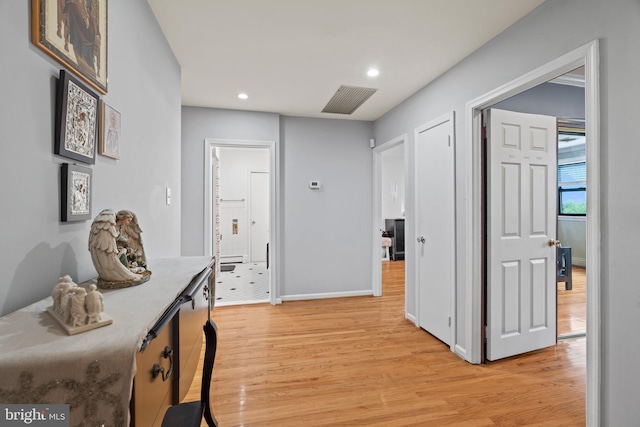 hall with light hardwood / wood-style flooring