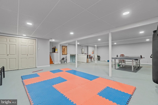 workout room featuring a paneled ceiling