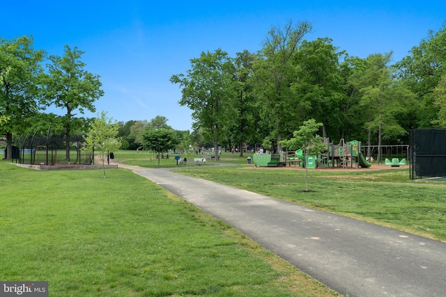 surrounding community featuring a yard and a playground