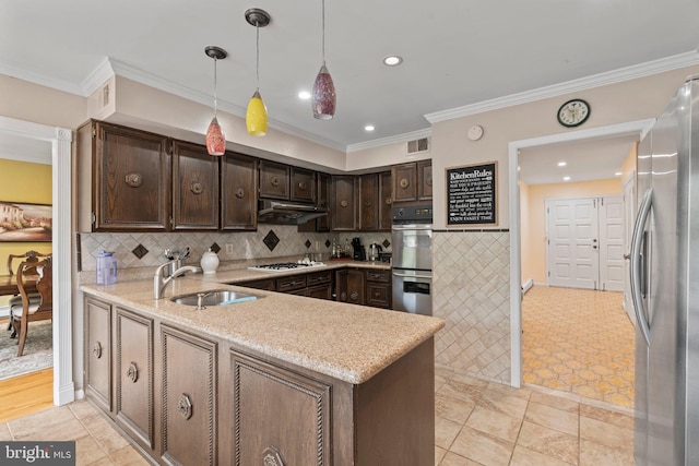 kitchen with dark brown cabinetry, sink, hanging light fixtures, kitchen peninsula, and stainless steel appliances