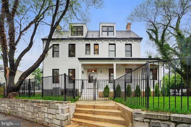 view of front of home featuring a front lawn and a porch