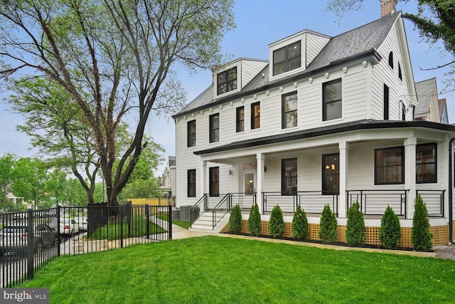 view of front of house featuring a front yard and a porch