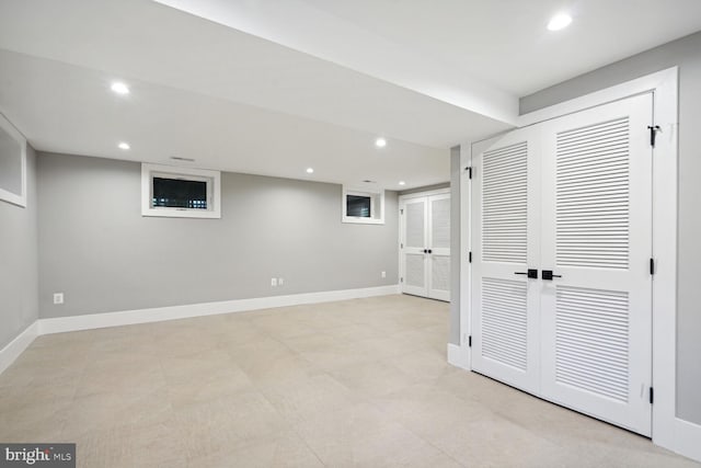 basement featuring light tile floors