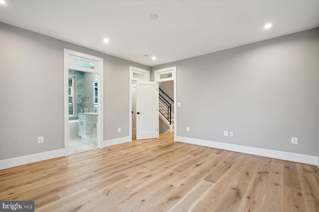 spare room with light hardwood / wood-style flooring