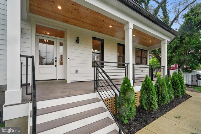 property entrance with covered porch