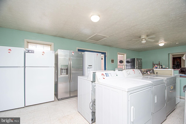 laundry room featuring ceiling fan, separate washer and dryer, a textured ceiling, and light tile floors