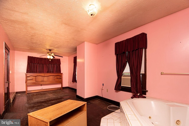 interior space with a textured ceiling and ceiling fan