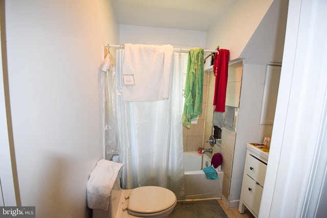 full bathroom featuring vanity, toilet, and shower / tub combo