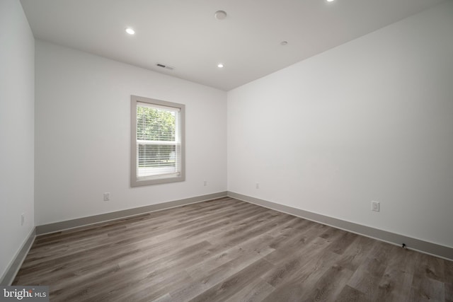 spare room featuring hardwood / wood-style flooring