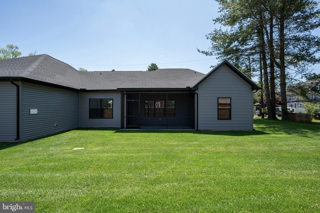 rear view of house with a lawn