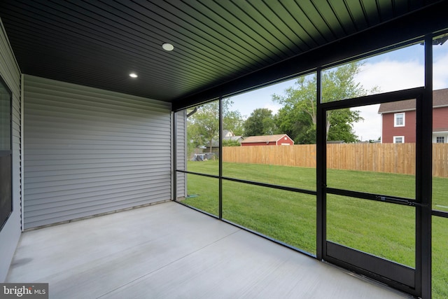 unfurnished sunroom with a healthy amount of sunlight