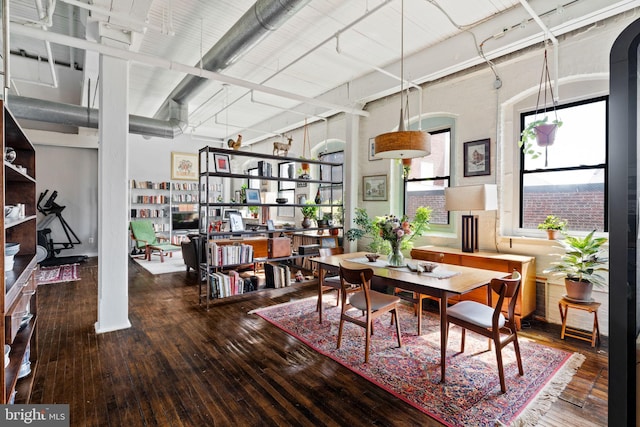 dining area with hardwood / wood-style flooring