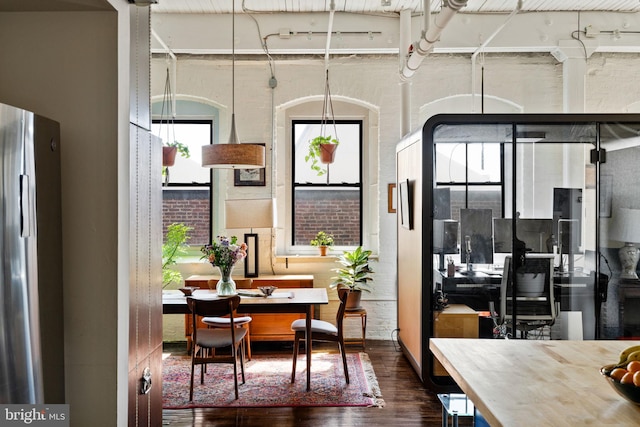 dining area with dark hardwood / wood-style flooring