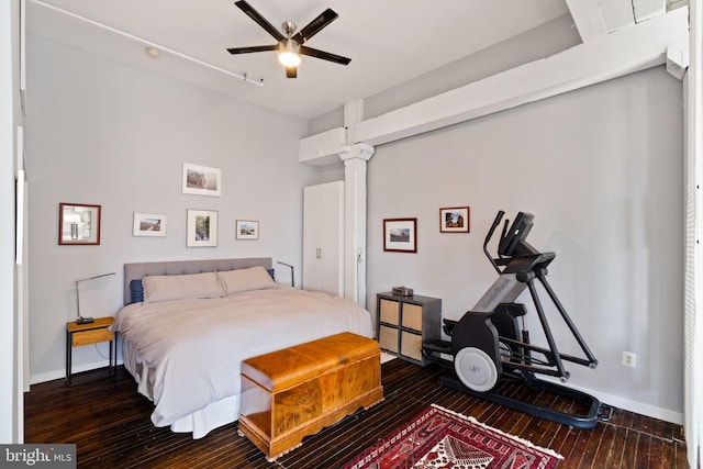 bedroom with ceiling fan and dark hardwood / wood-style flooring