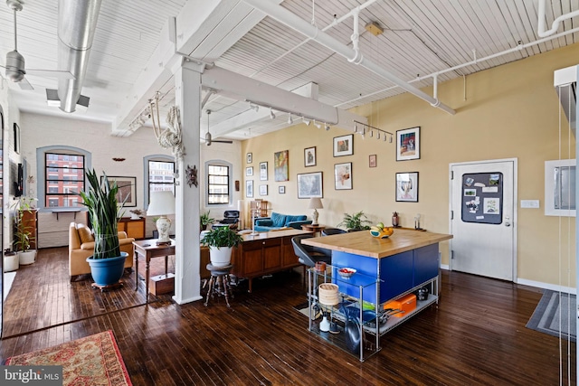 office with ceiling fan, dark hardwood / wood-style flooring, and track lighting