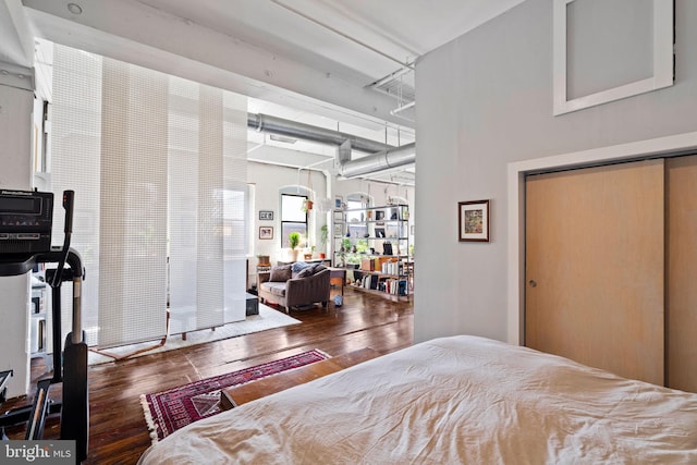 bedroom featuring dark wood-type flooring