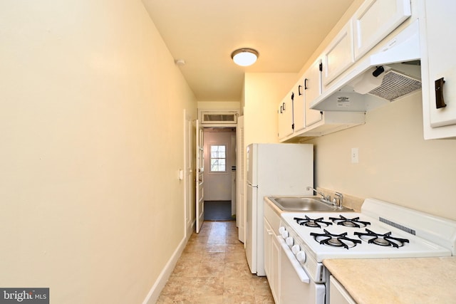 kitchen featuring white range oven, sink, white cabinets, and light tile floors