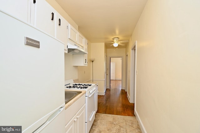 kitchen featuring ceiling fan, white cabinetry, white appliances, and light tile floors