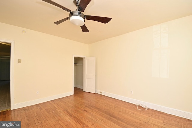 unfurnished room featuring ceiling fan and light hardwood / wood-style flooring