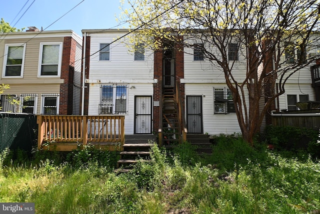 view of front of home featuring a wooden deck