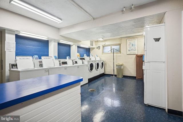 kitchen with stainless steel counters and washer and clothes dryer