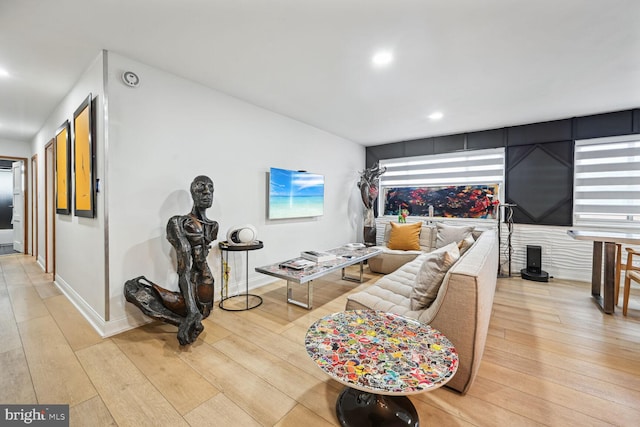 living room with light hardwood / wood-style flooring