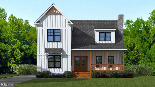 modern inspired farmhouse with a front yard